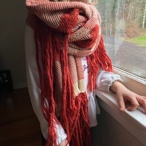 Long burnt orange and cream colored scarf